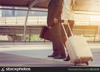 Businessman and businesswoman traveler with luggage at city background, Business People Commuter Walking City Life Concept.
