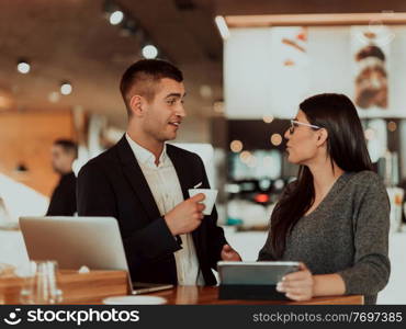 businessman and businesswoman use modern devices, laptop, tablet, and smartphone and arrange new projects for the job. Business concept . businessman and businesswoman use modern devices, laptop, tablet and smartphone and arrange new projects for the job.