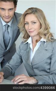 businessman and businesswoman with laptop
