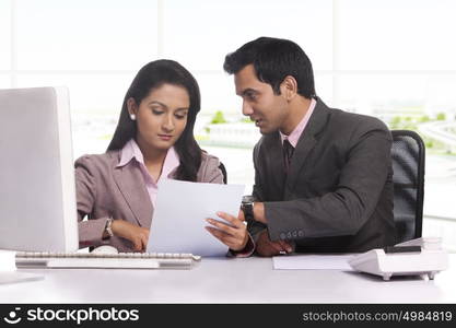 Businessman and businesswoman working together