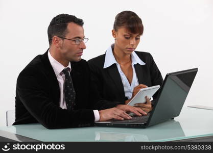 businessman and businesswoman working together