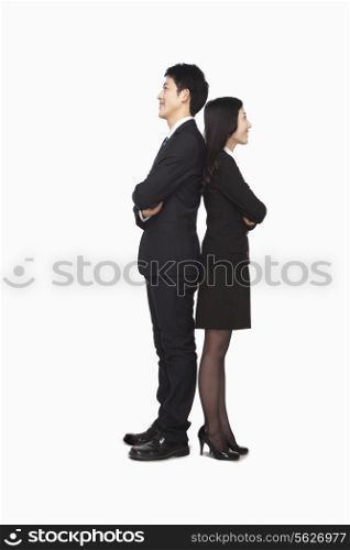 Businessman and businesswomen standing back to back