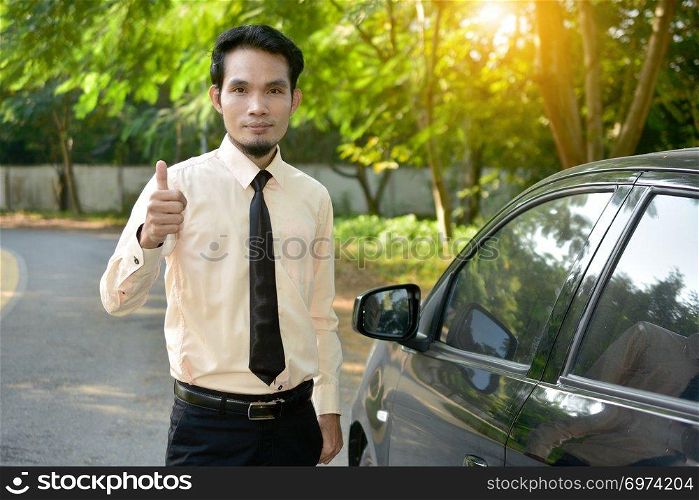 Businessman and car parked on street,insurance marketing concept