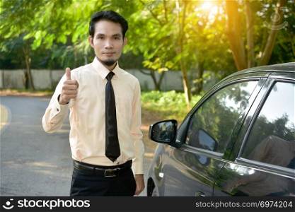 Businessman and car parked on street,insurance marketing concept