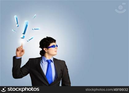 Businessman and exclamation mark. Image of young businessman with exclamation mark