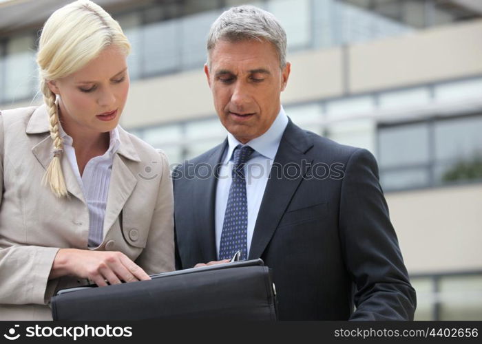 businessman and his assistant working on project