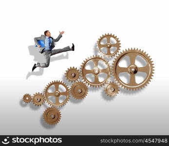 Businessman and mechanism elements. Businessman with cog wheel elements. Construction concept