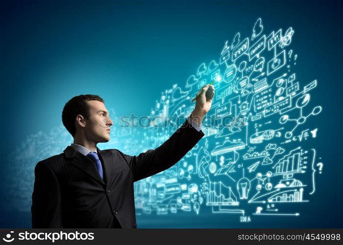 Businessman and media screen. Image of young businessman touching icon of media screen