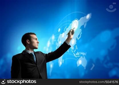 Businessman and media screen. Image of young businessman touching icon of media screen