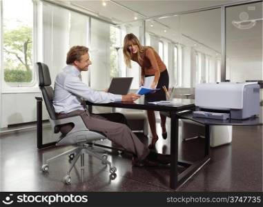 businessman and secretary using copy machine
