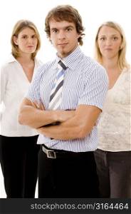 Businessman and two businesswomen looking serious