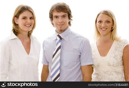 Businessman and two businesswomen smiling