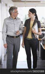 Businessman and Woman in Office