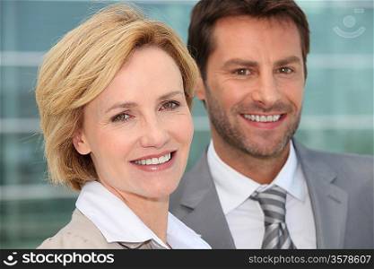 Businessman and woman smiling