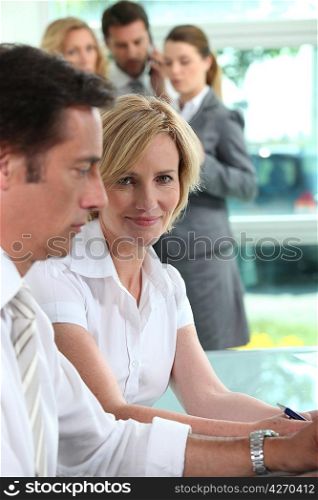 Businessman and woman smiling