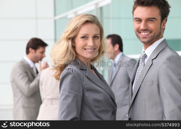 Businessman and woman smiling