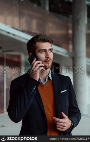 businessman architect expert using a smartphone while overseeing the construction site of a modern office building. businessman architect using a smartphone while overseeing the construction site