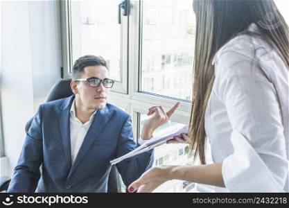 businessman asking questions businesswoman office