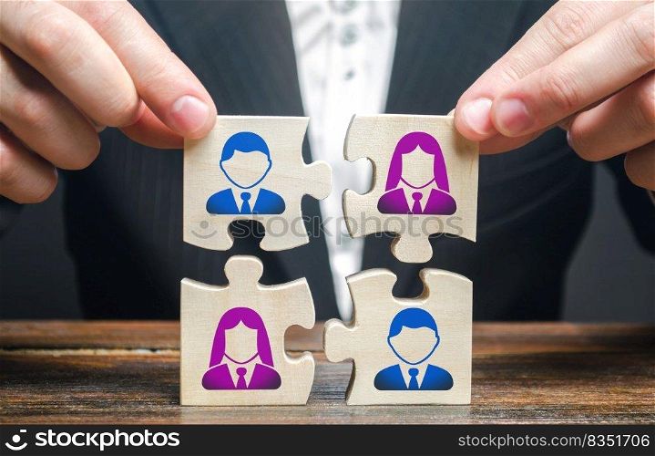 Businessman assembles a team in the form of a set of puzzles. Search, hiring and recruitment staff. Creating an efficient and productive business unit. Leadership and teamwork. Managerial qualities.