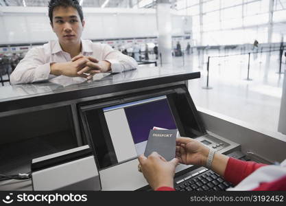 Businessman at a ticket counter in an airport