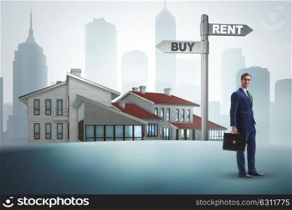 Businessman at crossroads betweem buying and renting. The businessman at crossroads betweem buying and renting