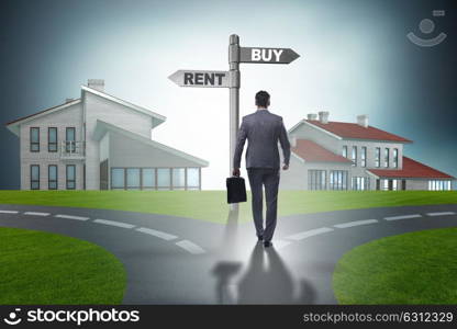 Businessman at crossroads betweem buying and renting. The businessman at crossroads betweem buying and renting