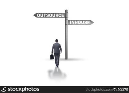 Businessman at crossroads deciding between outsourcing and inhouse. Businessman at crossroads deciding between outsourcing and inhou