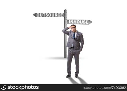 Businessman at crossroads deciding between outsourcing and inhouse. Businessman at crossroads deciding between outsourcing and inhou