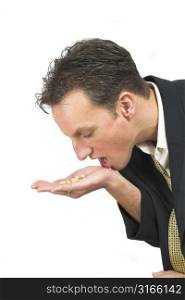 Businessman at the point of popping some pills into his mouth