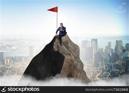 Businessman at the top of mountain 