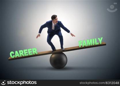 Businessman balancing between career and family in business conc. Businessman balancing between career and family in business concept