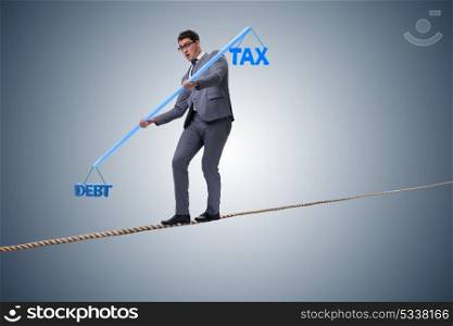 Businessman balancing between debt and tax