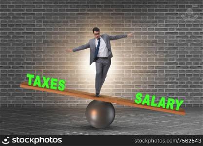 Businessman balancing between the taxes and salary. Businessman balancing between taxes and salary