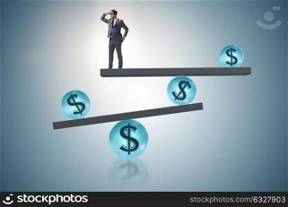 Businessman balancing in financial dollar concept. The businessman balancing in financial dollar concept