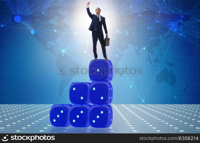 Businessman balancing on top of dice stack in uncertainty concept. Businessman balancing on top of dice stack in uncertainty concep