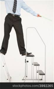 Businessman balancing on two ladders