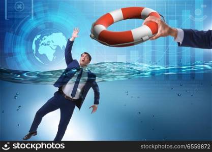 Businessman being saved from drowning