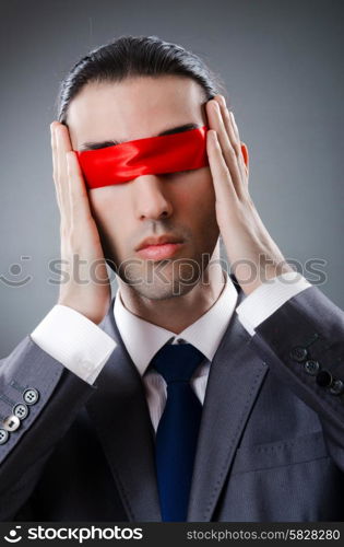 Businessman blinded by red tape