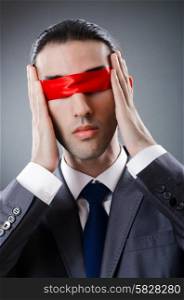 Businessman blinded by red tape