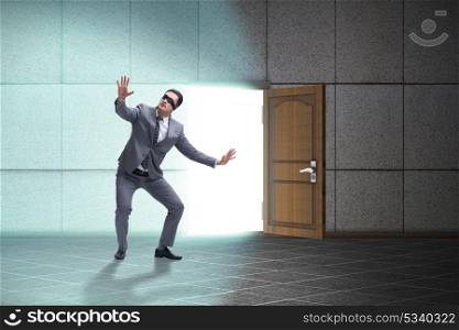 Businessman blindfold in uncertainty concept