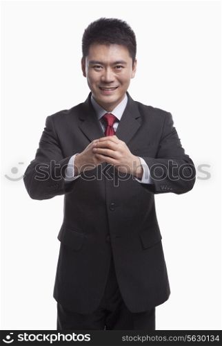 Businessman Bowing Toward Camera