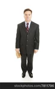 Businessman brings his lunch to work in a brown paper bag. Full body isolated on white.