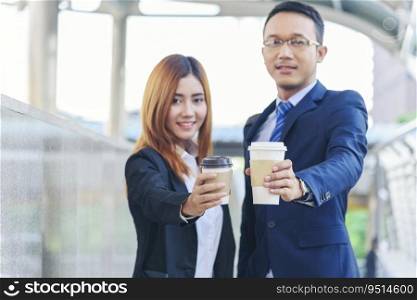 Businessman Businesswoman drink coffee in town outside office modern city. Hands holding take away coffee cup talking together happy fun. Partner Business people formal suit with cup of coffee
