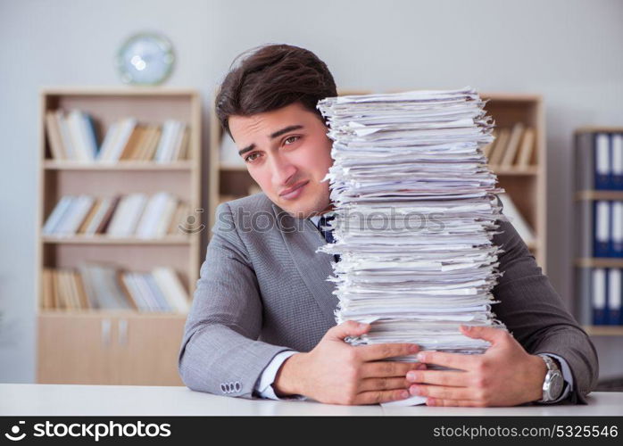 Businessman busy with paperwork in office