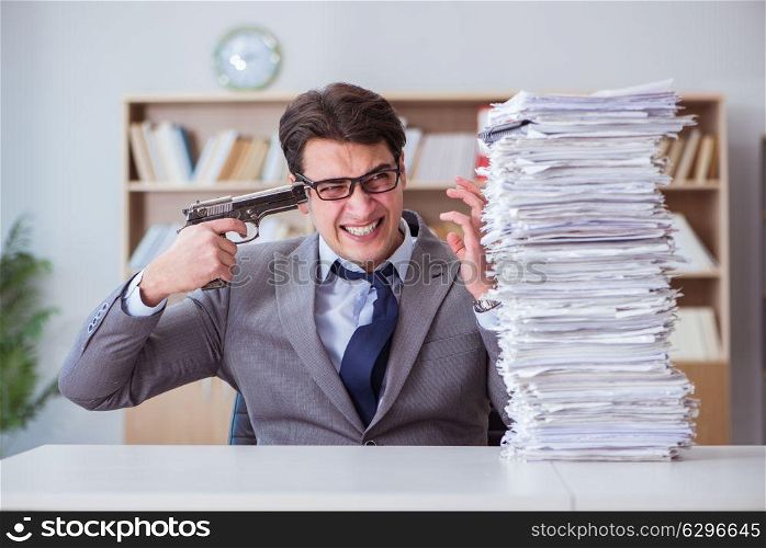 Businessman busy with paperwork in office