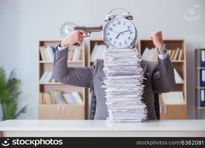 Businessman busy with paperwork in office