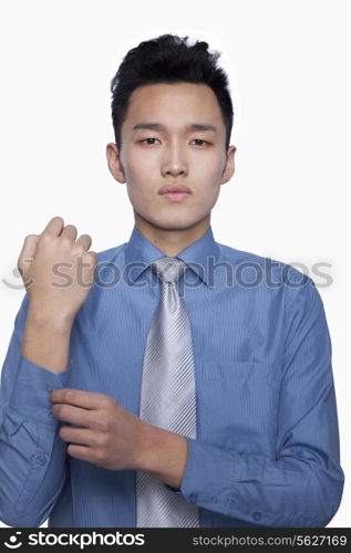 Businessman Buttoning His Sleeve