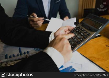 Businessman calculate Financial data analyzing counting .Business concept