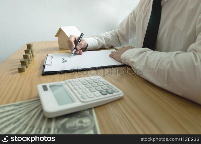 Businessman calculates buy - sale price house . Agent sale home insurance. business concept.