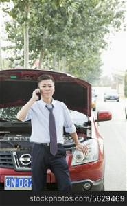 Businessman Calling for Roadside Assistance